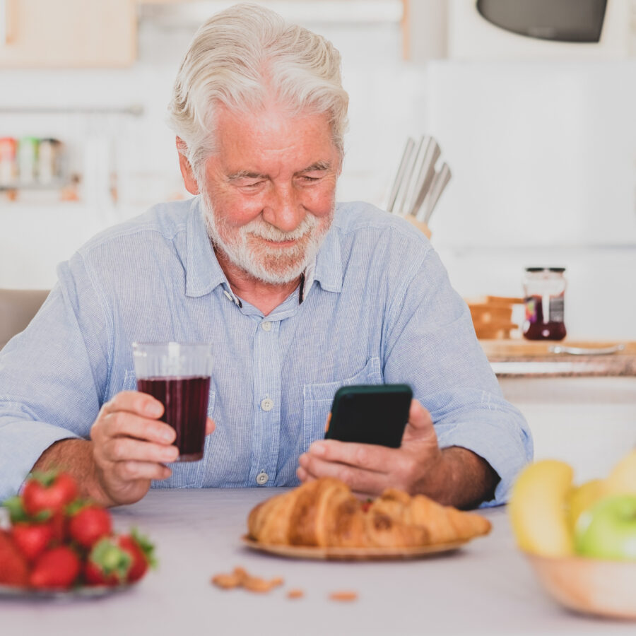 Senior man enters food in top nutrition