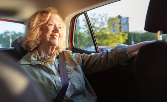 Senior woman utilizing personal transportation services