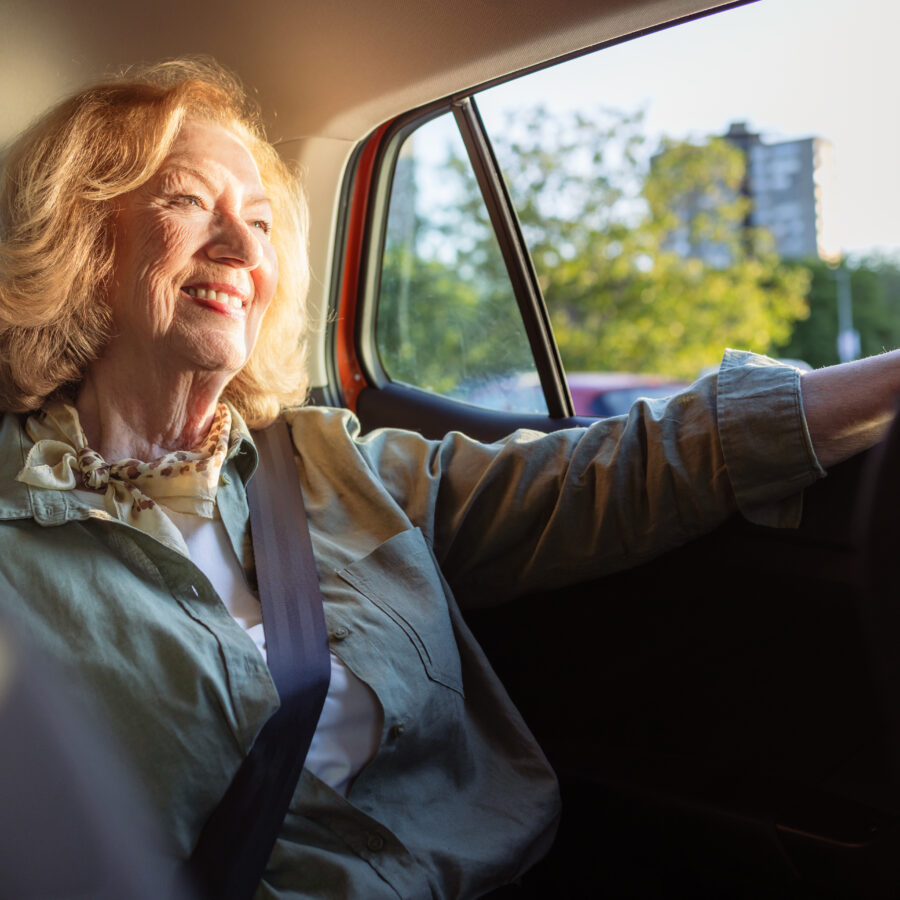 Senior woman utilizing personal transportation services