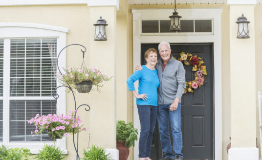 Senior couple in front of their home | Home Safety for Older Adults