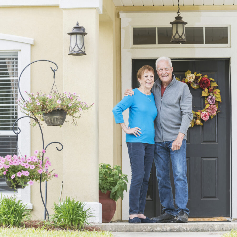 Senior couple in front of their home | Home Safety for Older Adults