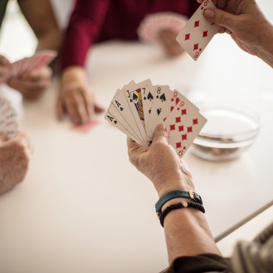 Group of seniors playing card games for seniors