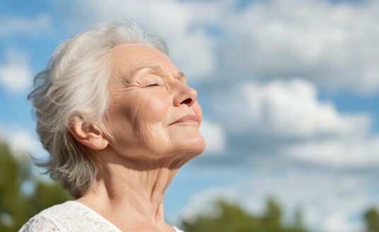 senior woman taking a breath on a sunny day, mental health