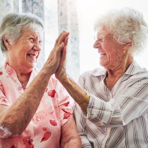 Happy, love and senior women with a high five for care