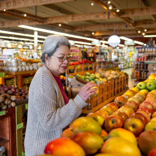 Woman grocery shopping for seniors