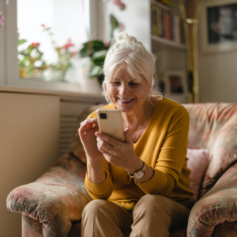 Woman utilizing social media safety tips to scroll on her phone