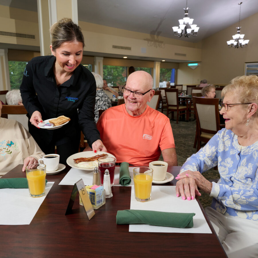 Bethesda Terrace dining employee serving breakfast to residents