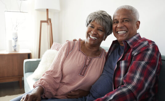 Smiling senior couple considering important retirement questions to ask
