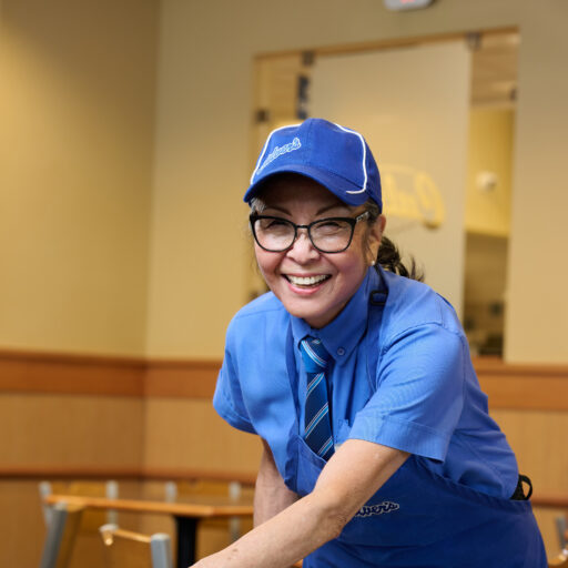 Bethesda Orchard resident, Patty, cleaning a table at her job at Culver's