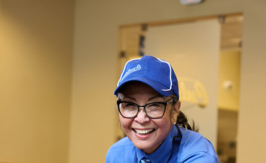 Bethesda Orchard resident, Patty, cleaning a table at her job at Culver's