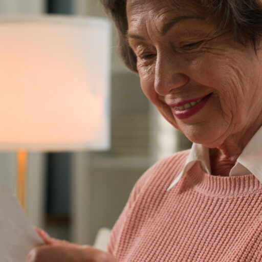 Senior woman reading written letters to seniors