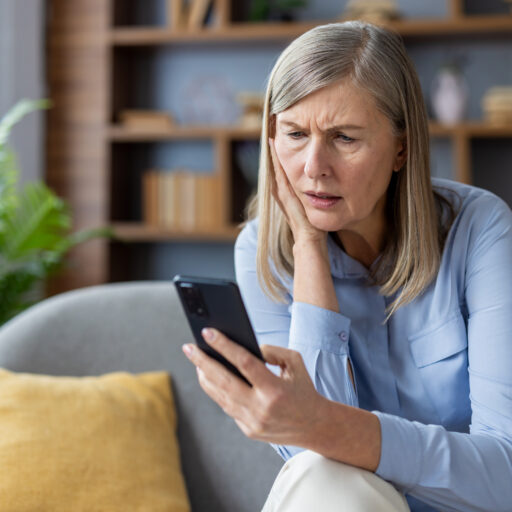 Senior woman spotting ai scams on social media for seniors